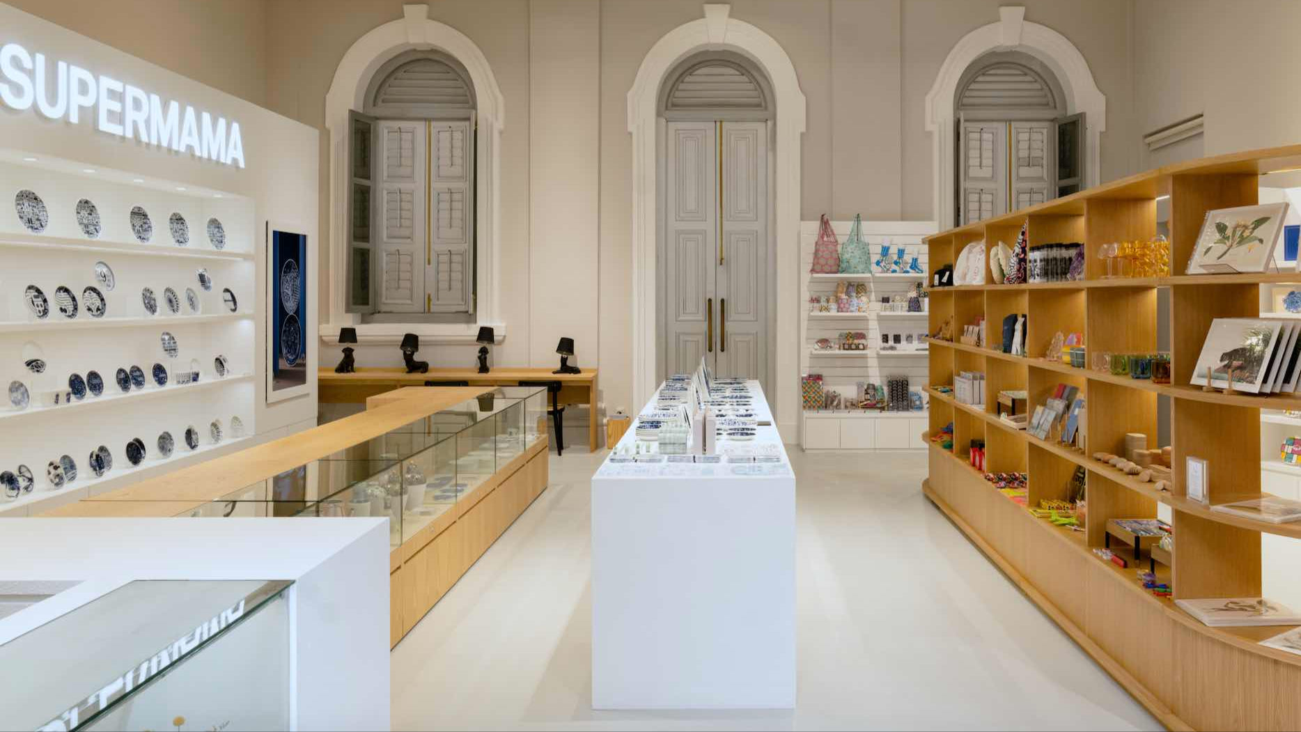 Asian Civilisations Museum store interior with 'SUPERMAMA' branding on shelves.